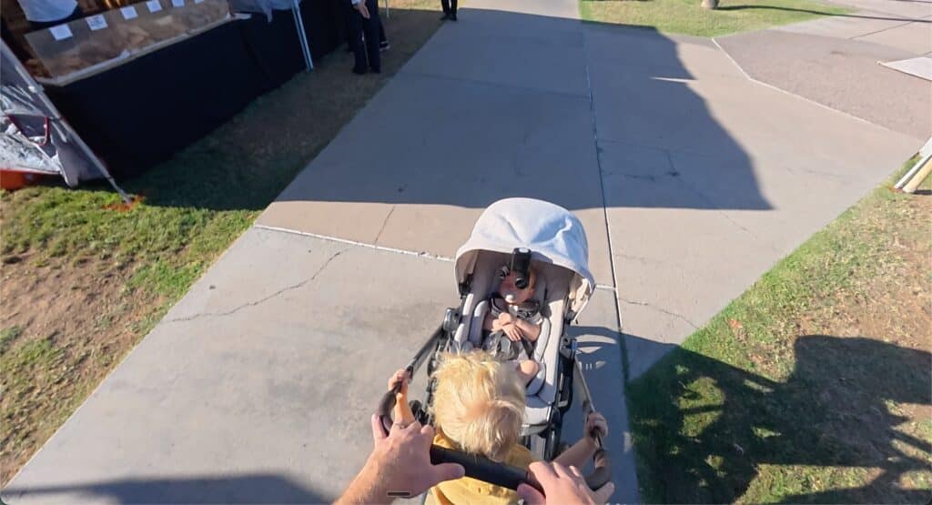 Two kids in the Uppababy Vista v3, the older one on the riding board
